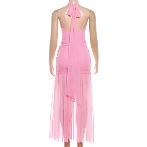 Back view detail showing the mesh stitching and halter neck design of the pink ruffled maxi dress