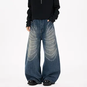 Jean large bleu high-street avec motif papillon au laser et strass brillants
