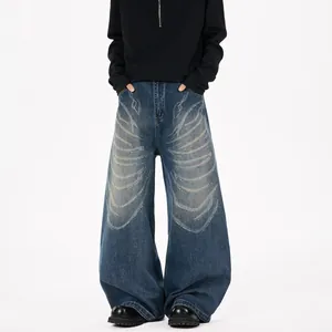 Jean bleu large style high-street avec motifs papillon laser et strass thermocollés