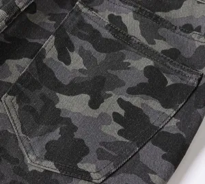 Close-up of pocket detail on men's dark grey camouflage cargo pants fabric