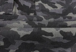 Close-up detail of the rugged camouflage pattern on these men's vintage cargo jeans.