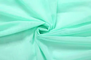 Close-up of mint green fine mesh fabric showing pleated texture and breathable weave.