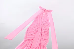 Detailed close-up view of a pink halter neck mesh dress featuring elegant ruched pleats
