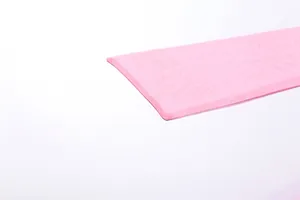 Close-up detail of soft pink mesh fabric showing fine texture and hem finish detail