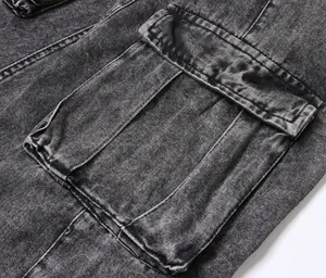 Close-up detail of side cargo pocket on men's vintage washed grey denim pants.