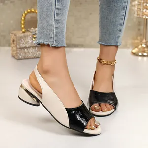 Elegant color-block peep-toe sandals with croc-embossed texture and block heel on foot