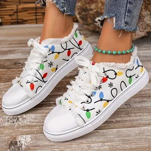 Stylish white canvas shoes featuring colorful Christmas bulb print and frayed denim edges