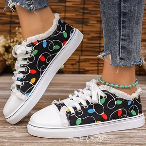 Close-up of casual women's canvas sneakers with colorful Christmas light bulb print