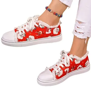 Women's red canvas shoes featuring Christmas Santa Claus and reindeer print design