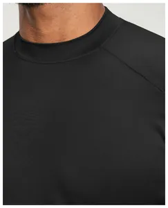 Detail close-up of the breathable neckline and raglan sleeve of this black sports t-shirt