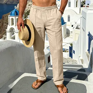 Men's loose breathable khaki linen drawstring trousers shown in a stylish vacation setting