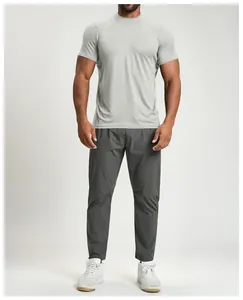 Professional front view of men's breathable light gray sports t-shirt and dark gray pants