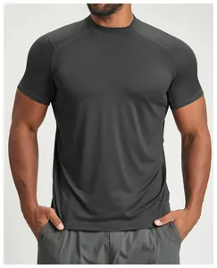 Detailed view of the athletic fit on a dark grey breathable sports t-shirt for men