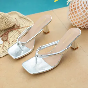 Chic silver square-toe thong sandals with kitten heels, perfect for summer beach vacations