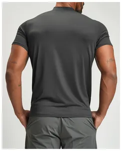 Detailed back view of a muscular man wearing a dark grey breathable athletic fitness T-shirt