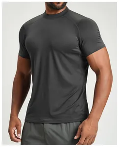 Close-up of a men's athletic short-sleeved t-shirt in dark gray with raglan sleeves.