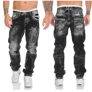 Detailed view of men's distressed black straight-leg denim jeans with pocket design