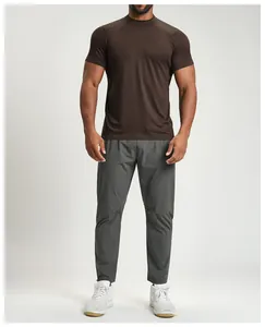 Professional detail view of a men's dark brown breathable athletic t-shirt for fitness.