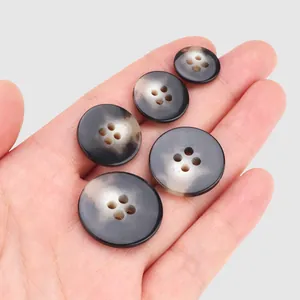 Premium marbled urea buttons in five different sizes for high-end workwear and coats