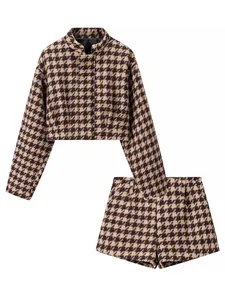 Two-piece houndstooth set featuring a cropped jacket and high-waist shorts