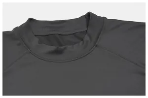 Close-up of dark grey men's sports T-shirt neckline with raglan sleeve stitching detail.