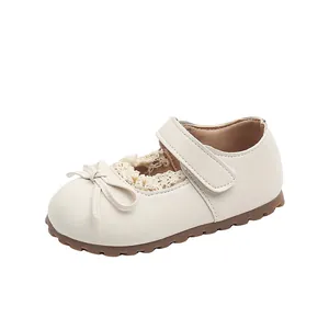 Classic beige Mary Jane princess shoes for toddler girls with lace trim and bow detail