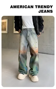 Close-up detail of colorful tie-dye rainbow wash on loose straight fit denim jeans