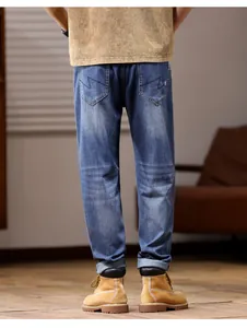 Back view of men's loose straight-leg denim blue jeans with pocket embroidery