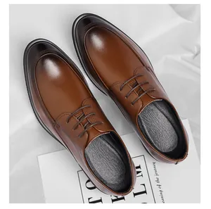 Detailed top view of brown leather lace-up shoes with burnished toe and textured sides