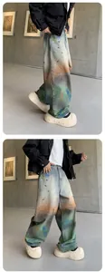 Detailed side and front view of loose wide-leg jeans with vibrant rainbow tie-dye wash