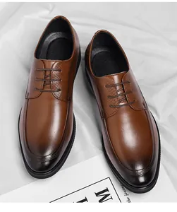 Close-up of brown leather dress shoes with gradient toe and textured panels