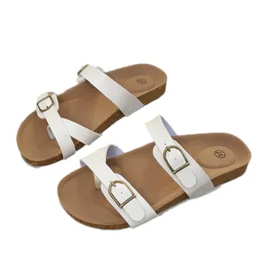 Vintage style white toe-ring sandals for women featuring double gold buckles and cork soles