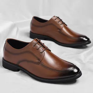 Classic men's brown leather dress shoes featuring a gradient toe and secure lace-up closure.