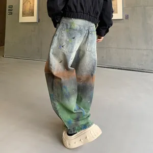 Fashionable loose straight-leg denim jeans with a unique rainbow gradient wash effect