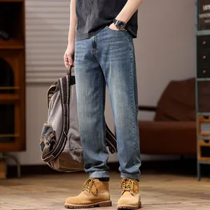 Men's loose fit stretch straight leg denim jeans in a classic denim blue wash for autumn
