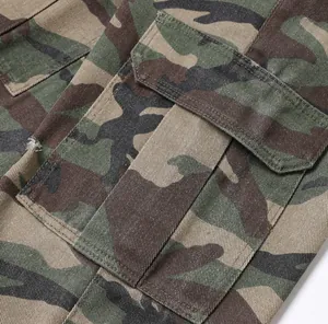 Close-up of camo cargo pants showing pocket detail and durable twill fabric
