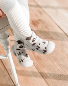 Close-up of baby walking shoes with panda pattern and soft anti-slip rubber sole