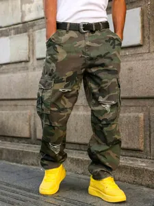 Men's camouflage cargo pants with distressed ripped details in a relaxed straight fit