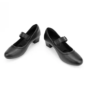 High-quality detail view of retro black Mary Jane shoes featuring round toe and chunky heel.