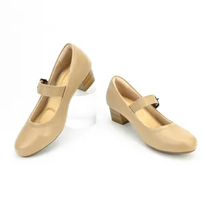 Close-up of retro beige Mary Jane shoes with block heel and adjustable strap
