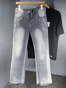 Jeans da Uomo con Schizzi d'Inchiostro Distressed a Zampa Streetwear Americano Pantaloni in Denim Lavato Retro Grigio
