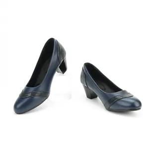 Detail shot of navy blue square toe pumps with snake-skin texture and block heel