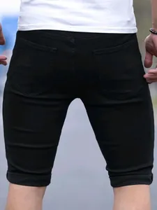 Back view detail of men's slim fit black washed denim shorts with rear pockets