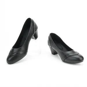 Elegant black women's low block heel pumps with textured snake-skin detail