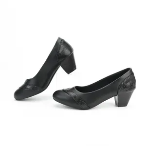 Elegant black low block heel pumps featuring refined snakeskin texture accents for women