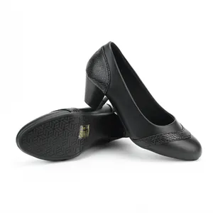 Detail view of black women's block heel pumps with square toe and woven texture.