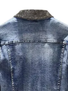 Macro view of men's winter denim jacket showing fleece collar and washed texture.