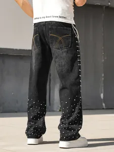 Back view detail of men's loose straight jeans with rhinestone studs and pearl chain