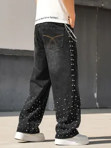 Detailed back view of men's loose straight black jeans with rhinestone embellishments