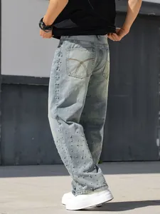 Side view of loose straight-leg men's jeans featuring sparkling rhinestone embellishments